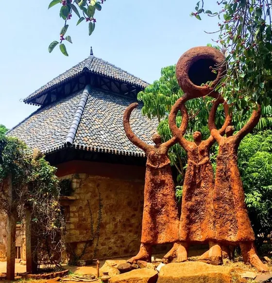 Statue of three women inside Nrityagram